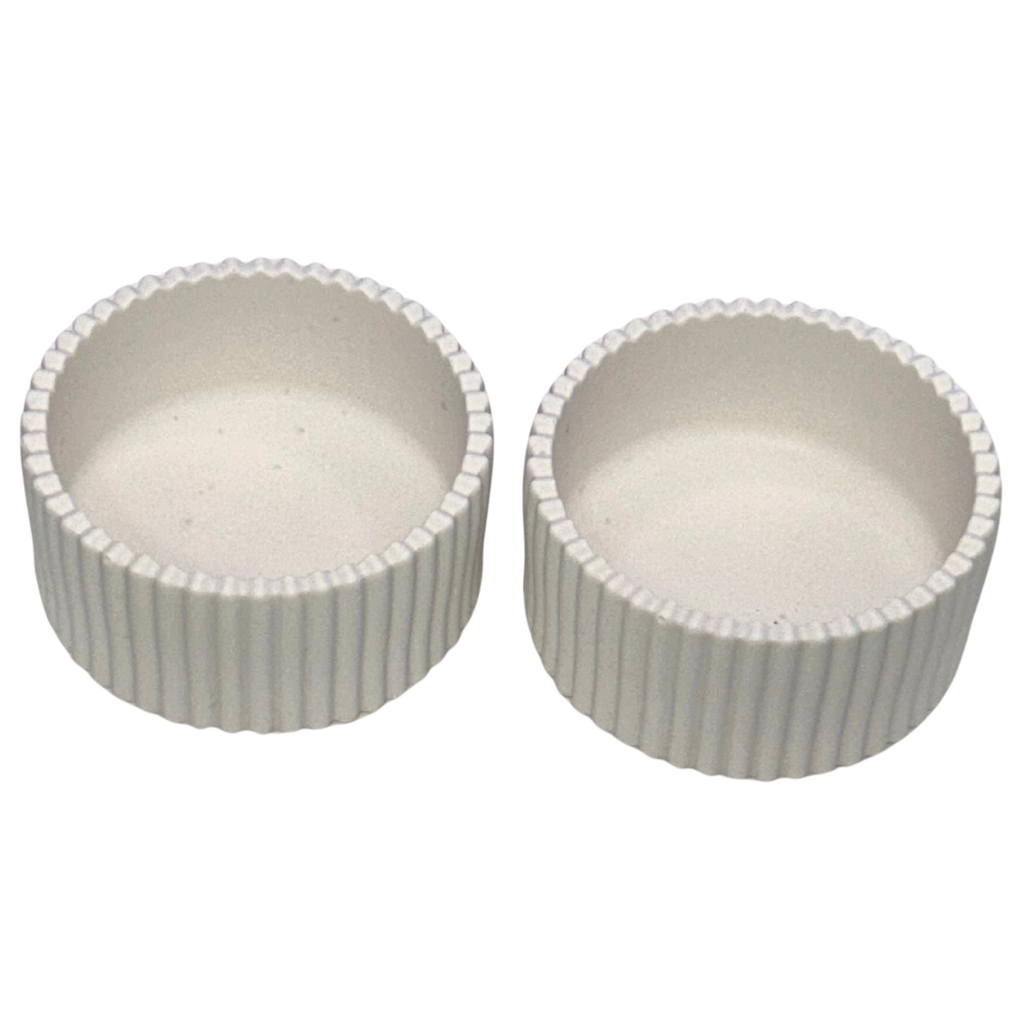 Two white jesmonites ribbed jars with ribbed texture on a white background