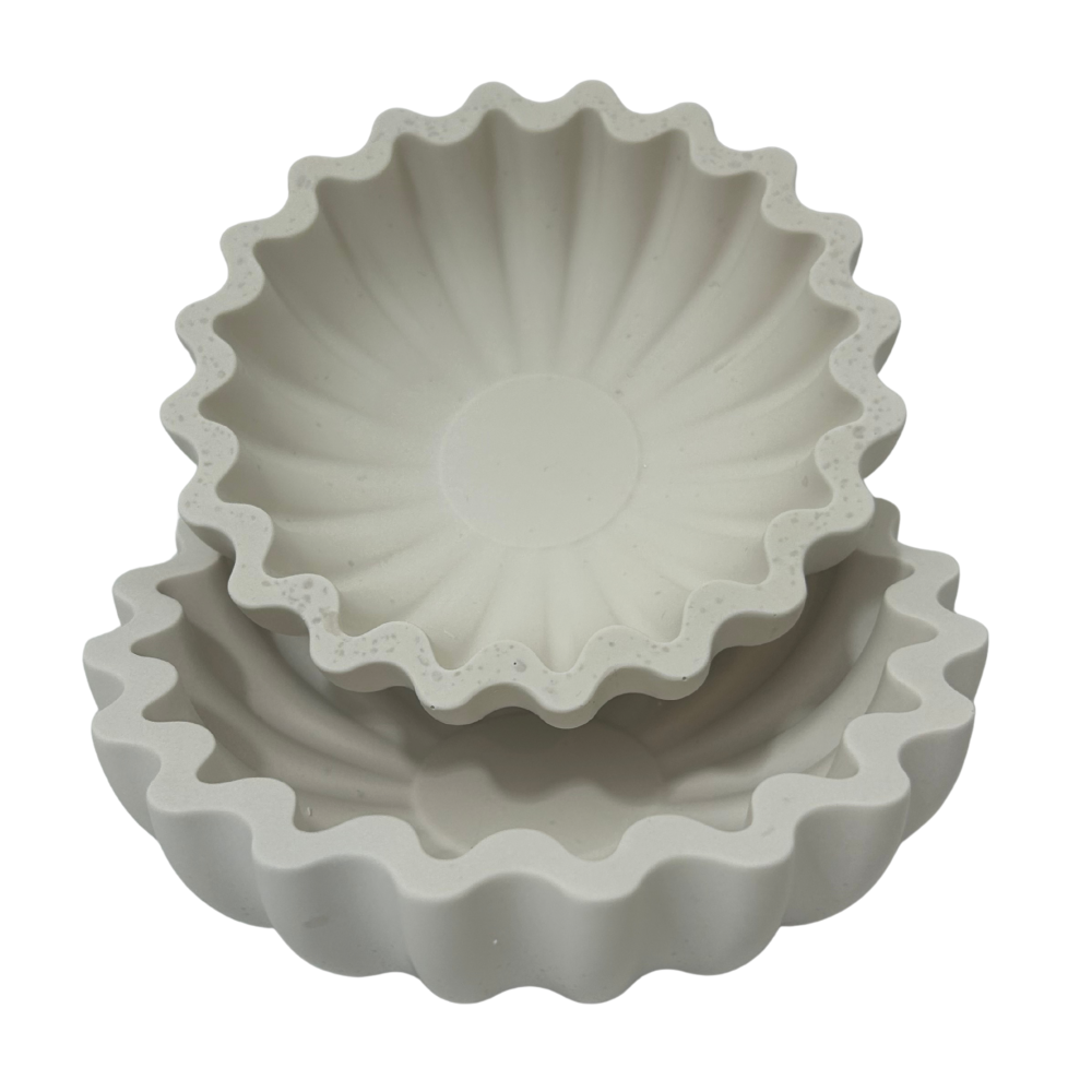 Set of two white wavy edges seas shell style dishes on a white background