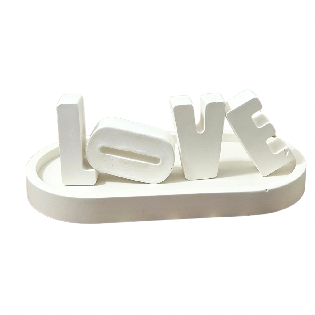 White decorative letters spelling 'LOVE' on a white background