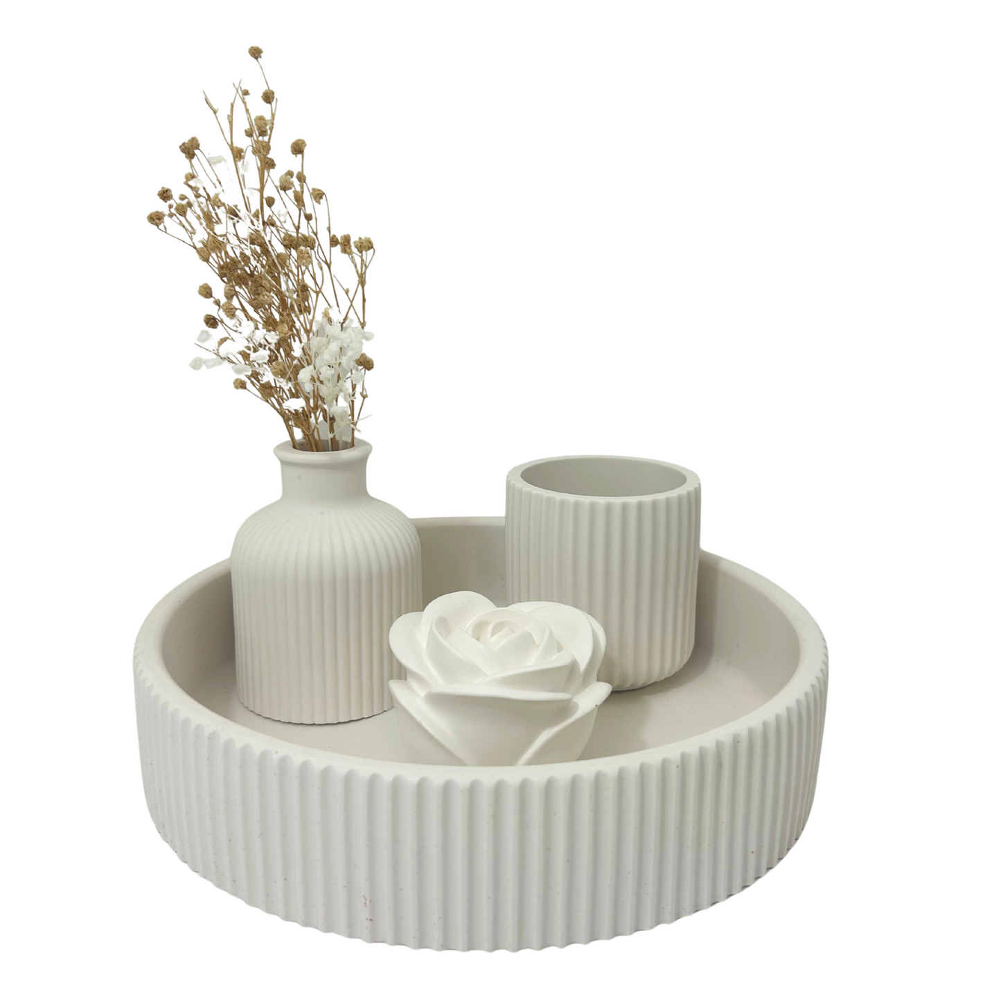 Decorative jesmonite tray with a vase, candle, and rose on a white background