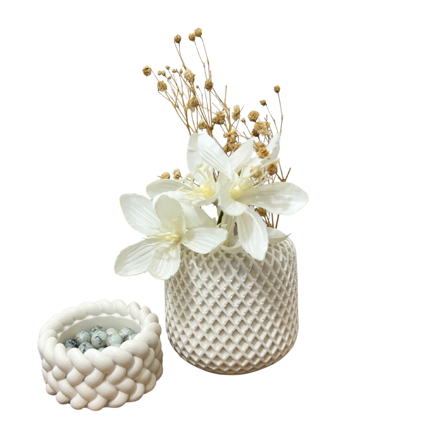 Two textured vases with floral arrangements on a white background