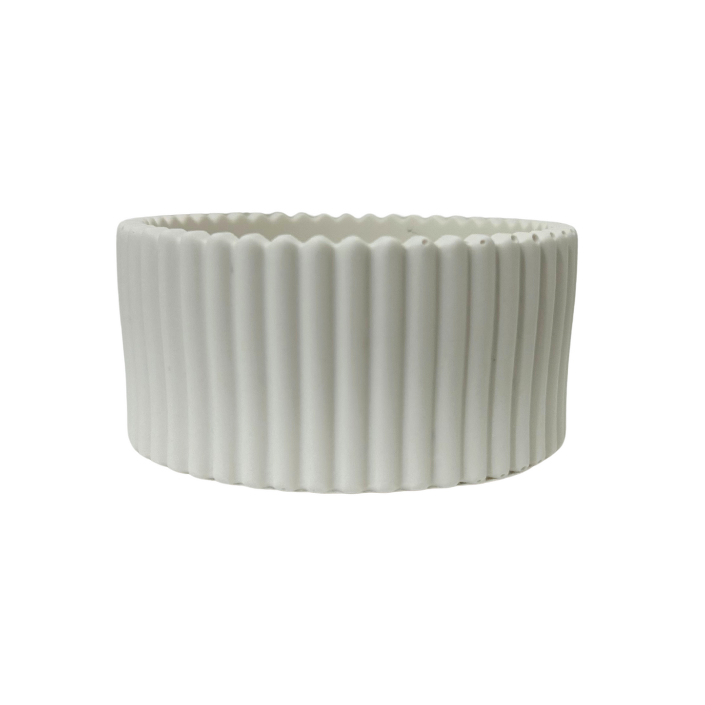 White jesmonite bowl with ribbed texture on a white background