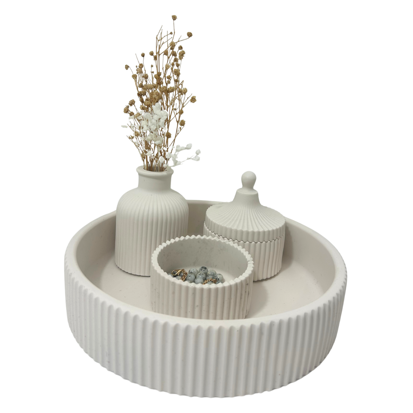 Decorative set with a round white tray, vases, and a small container on a white background