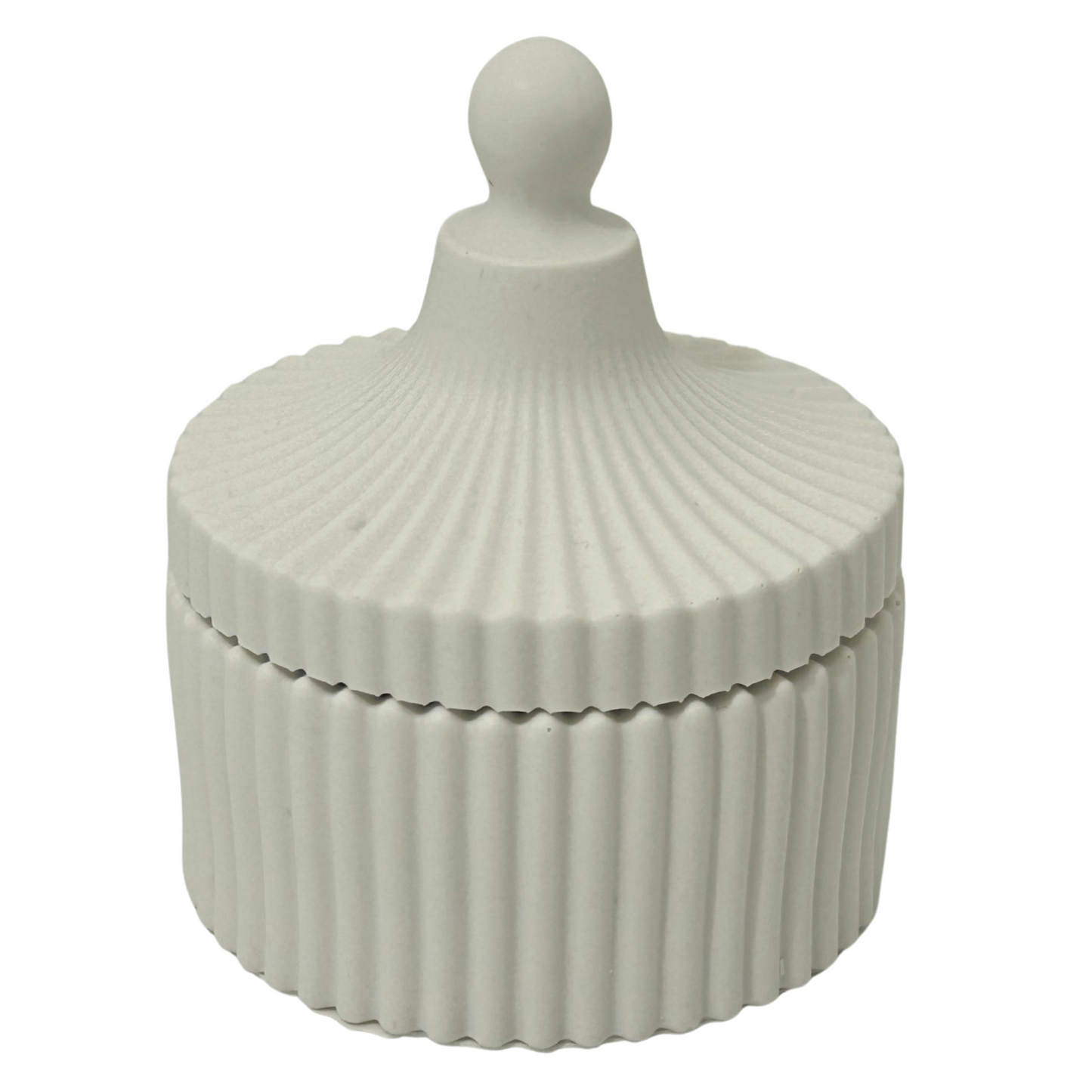 Jesmonite ribbed decorative box with a spherical finial on a white background