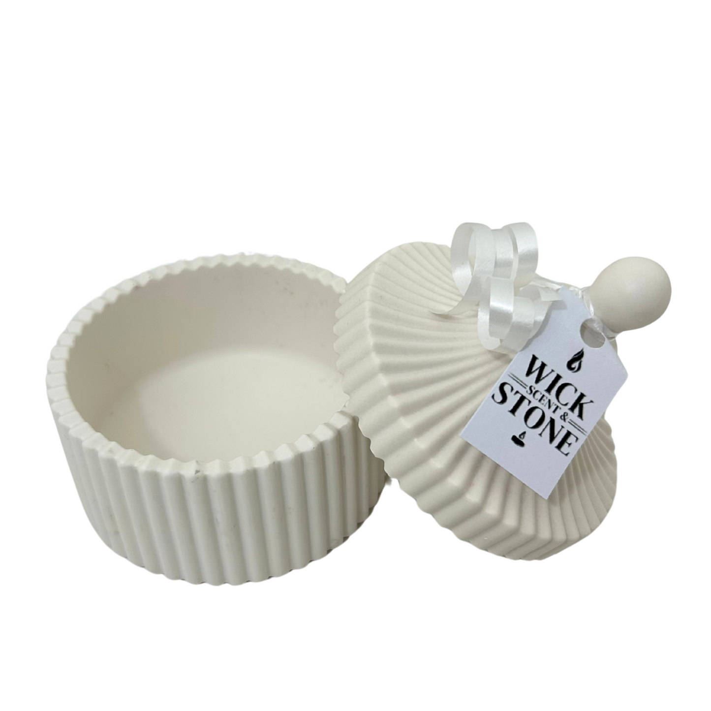 Jesmonte ribbed container with lid and 'Wick & Stone' tag on a white background