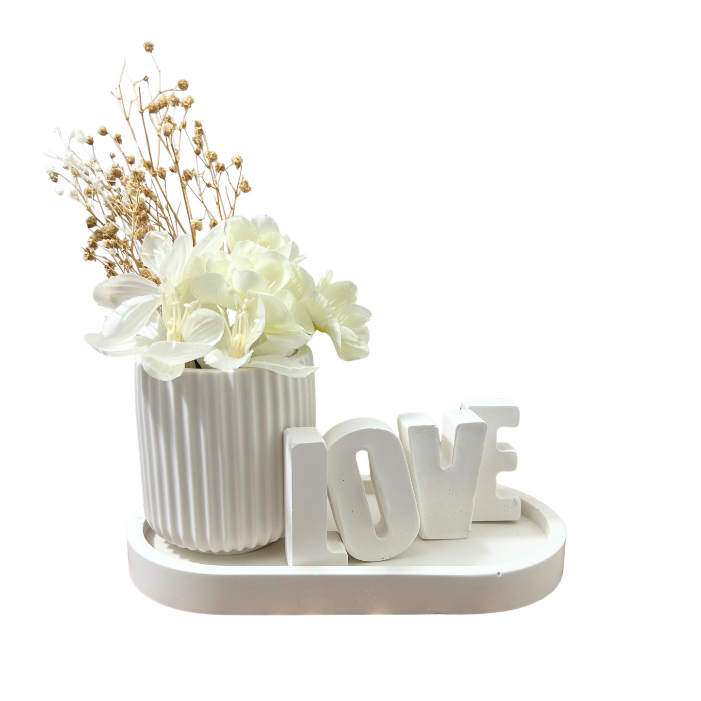 Decorative set with a jesmonite ribbed vase and 'LOVE' letters on a white background