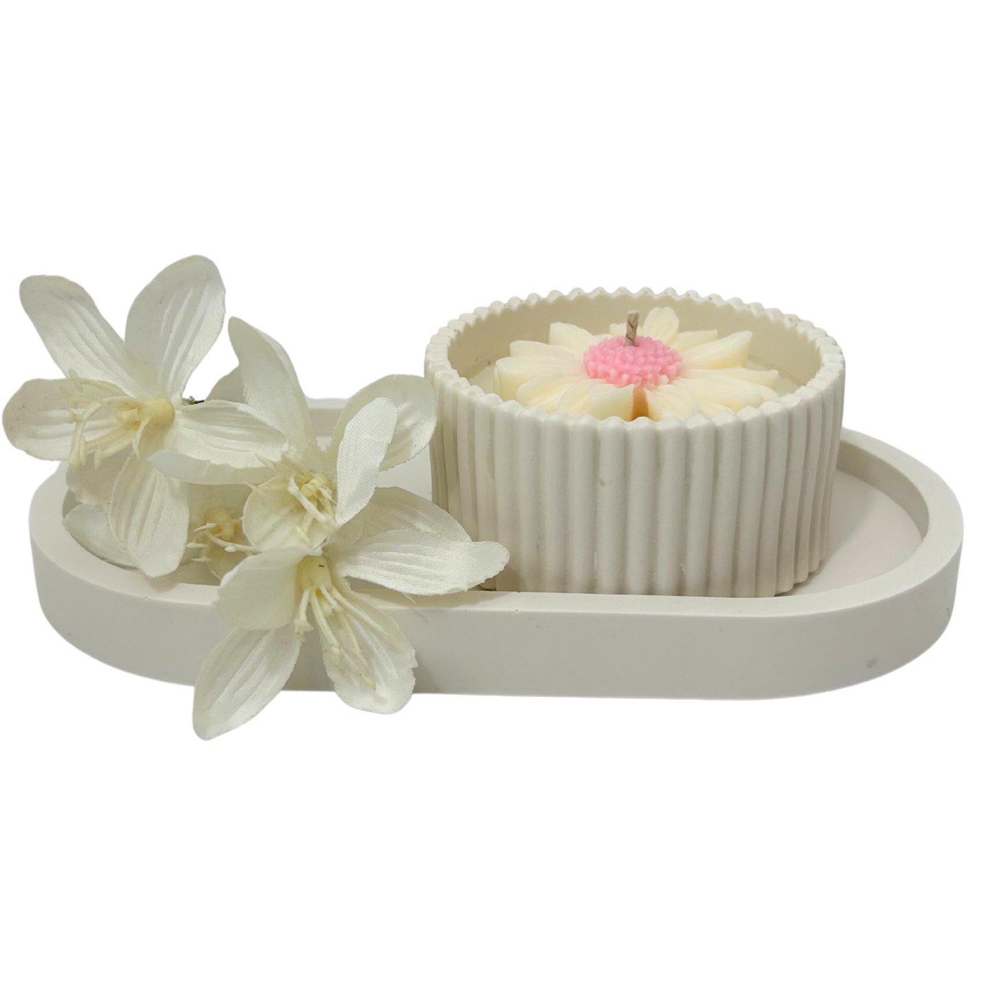 Decorative set with a small candle daisy jar and flowers on a white background