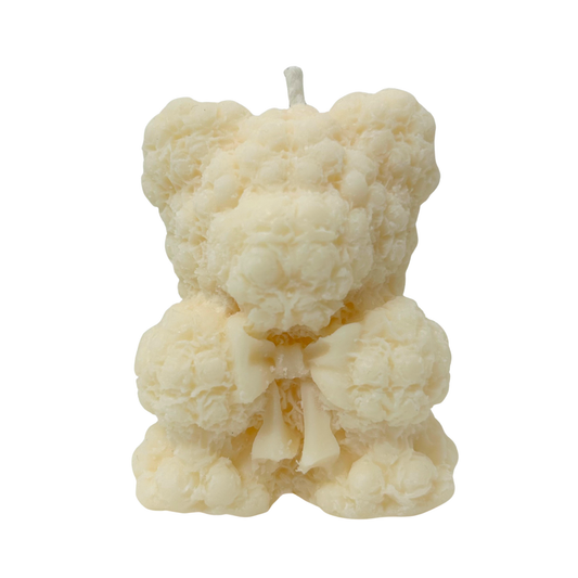 Candle shaped like a bear with rose texture on a white background