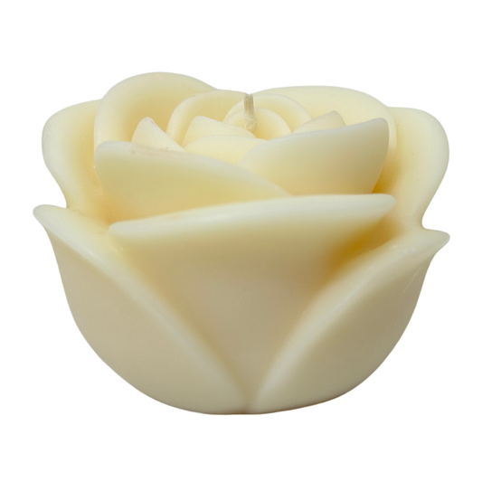 Cream-colored rose-shaped candle on a white background