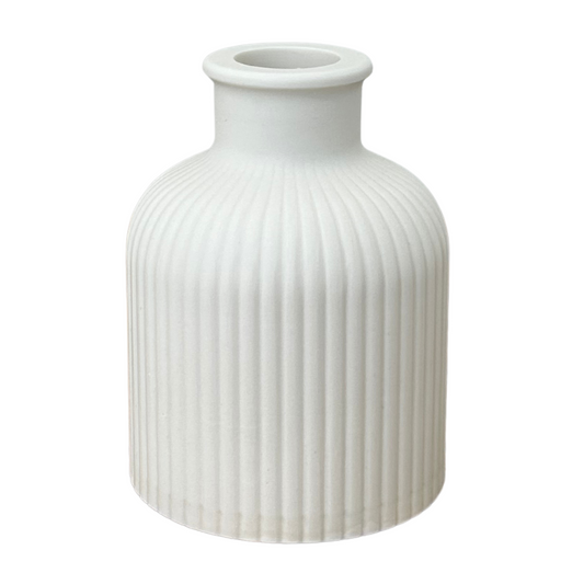 Jesmonite ribbed vase on a white background