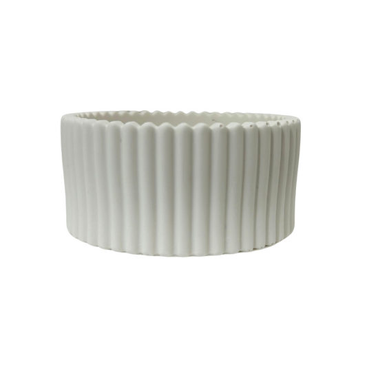 White jesmonite bowl with ribbed texture on a white background