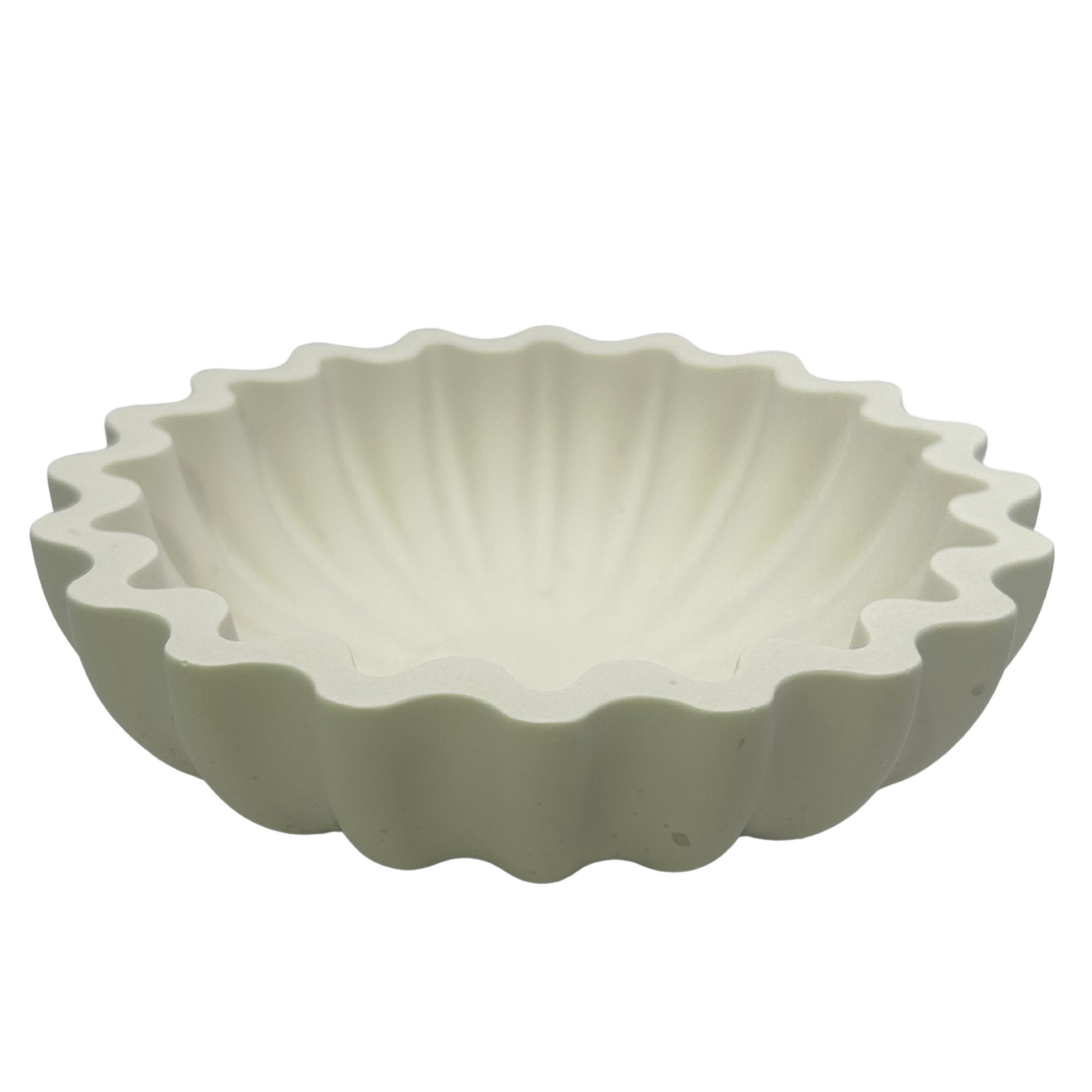 White wavy edge sea shell style dish on a white background
