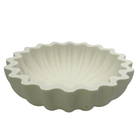 White wavy edge sea shell style dish on a white background