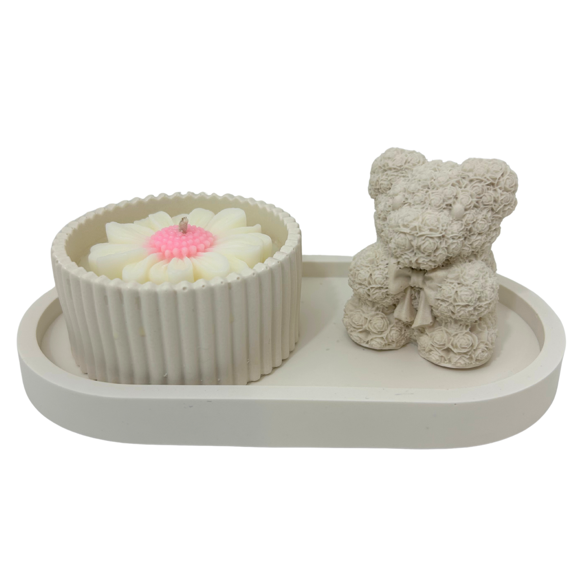 Decorative tray with a candle and a teddy bear on a white background