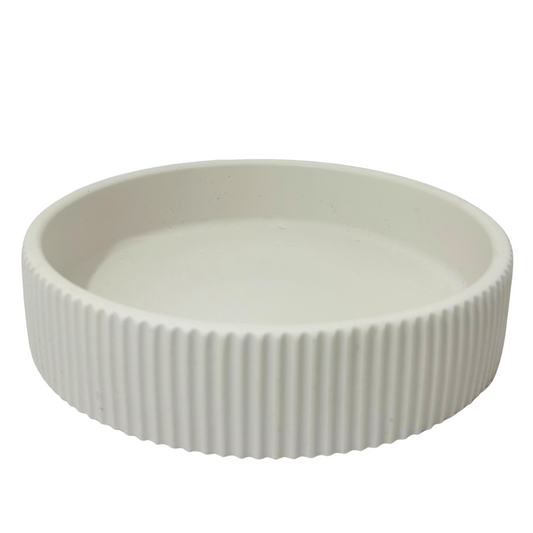 Jesmonite tray with ribbed texture on a white background