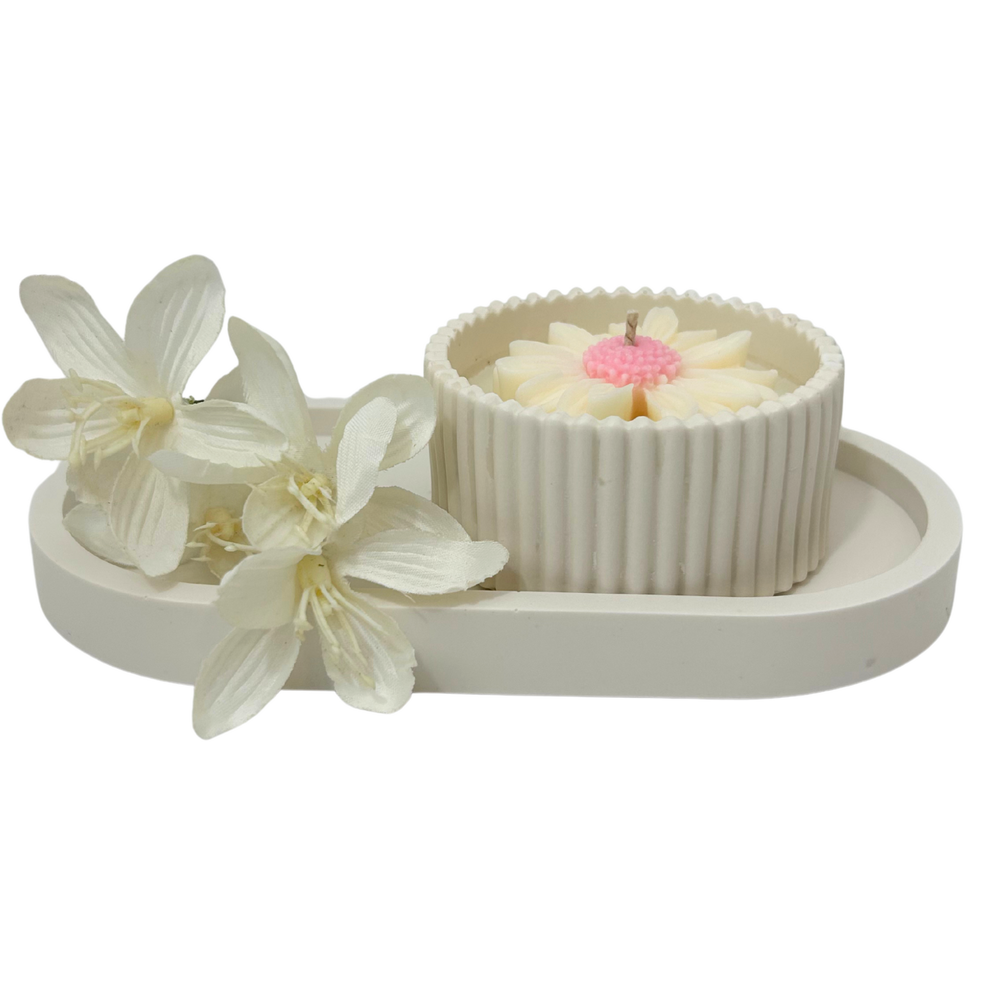 Decorative set with a small candle daisy jar and flowers on a white background